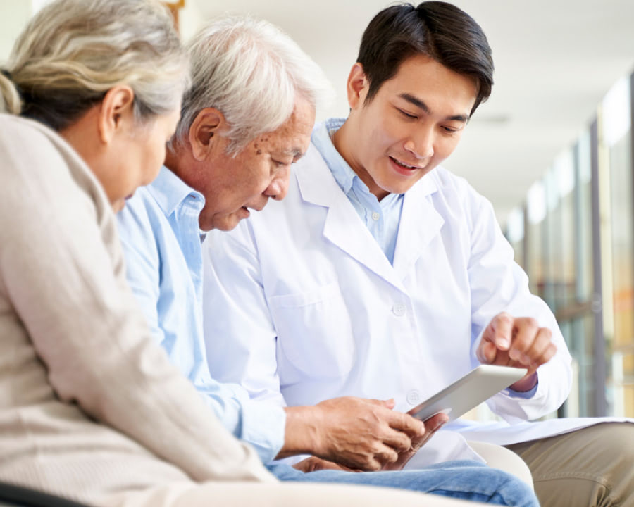 Compassionate Doctor showing Care to an older couple at Gastro Florida